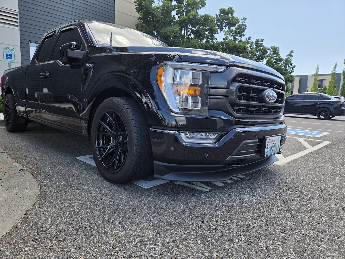 Customer's Ford F-150 with the front splitter installed at Edison Automotive
